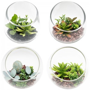 Keinotekoiset mehikkaiset kasvit, joissa on lasinen pöytäkoristeellinen maapalloesitysmaljakko
